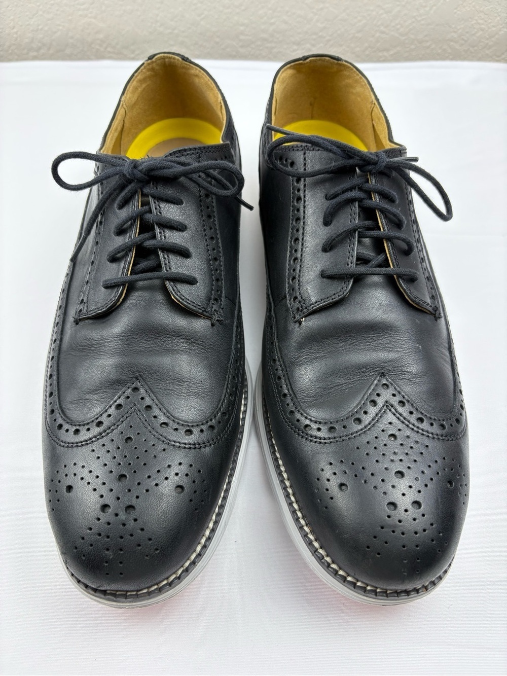 Cole Haan Original Grand wingtip Oxford shoes in black leather.